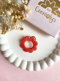 Pin's à lunettes - fleur corail
