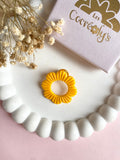 Pin's à lunettes - fleur jaune