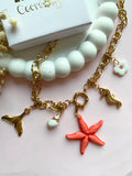 Collier MAUDE étoile de mer corail - avec 5 charm's interchangeables