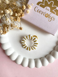 Pin's à lunettes - fleur blanche dorée