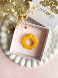 Pin's à lunettes - fleur jaune