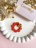 Pin's à lunettes - fleur corail