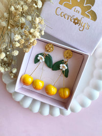 Puces d’oreilles cerises jaunes