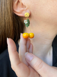 Puces d’oreilles cerises jaunes