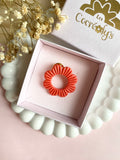 Pin's à lunettes - fleur corail