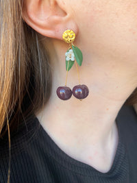 Puces d’oreilles cerises noires
